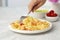 Italian pasta fettuccine with shrimps in white bowl on gray table. Close up beautiful picture homemade national cuisine