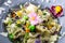 Italian pasta fettucine with chicken pieces and flowers decoration