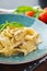 Italian pasta pappardelle with wild mushrooms and creamy sauce