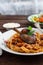 Italian pasta plate Tagliatelle with rabbit ragout, close view