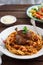 Italian pasta plate Tagliatelle with rabbit ragout, close view