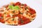 Italian Pasta Ravioli with tomato sauce on plate