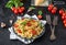 Italian pasta with sauce, cherry tomatoes, basil and parmesan cheese. Delicious pasta plate. Vegan pasta.