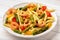 Italian pasta with shrimps, asparagus, paprika and tomatoes.