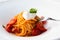 Italian pasta - spaghetti with burrata cheese closeup, mediterranean diet