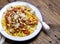 Italian pasta with tomato sauce, smoked pancetta, roasted almond