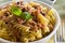 Italian pasta with tuna, black peppers and tomatoes