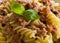 Italian pasta with tuna, black peppers and tomatoes