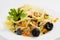 Italian pasta with tuna meat and black olives