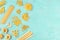 Italian pasta variety, flat lay banner, shot from above on a blue background