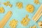 Italian pasta variety, flat lay banner, shot from the top on a teal blue background, a frame