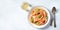 Italian pasta and wine panorama. Spaghetti with tomato sauce, cheese and basil, shot from the top