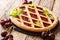 Italian pastries: cherry pie Crostata close-up on the table. horizontal, rustic