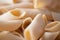 Italian pennoni tube pasta blur defocused food background