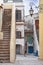 Italian picturesque alleys in San Felice Circeo old town village. Typical old houses reflecting the local architecture..