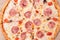 Italian pizza capriciosa close-up, top view