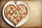 Italian Pizza with pear and gorgonzola in the shape of a heart and a pizza knife.
