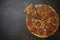 Italian pizza pepperoni on dark stone background