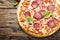 Italian pizza with tomato and salami