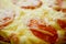 Italian pizza with tomatoes and cheese macro fragment, traditional food