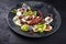 Italian polpo alla griglia su crema di patate with barbecued octopus, potato creme and fresh fruits on a Nordic design plate
