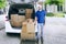 Italian postman and trolley packages with Santa hat