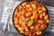 Italian potato gnocchi cooked with meat Bolognese sauce close-up in a plate. Horizontal top view