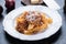 Italian ragu bolognese with flat fettuccine pasta