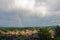 Italian rainy day with rainbow, big clouds