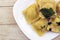 Italian ravioli garnished with cut parsley