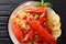 Italian recipe of spaghetti with boiled lobster, tomatoes, lemon