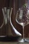 Italian red wine inside the decanter and goblet with decorations