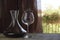 Italian red wine inside the decanter and goblet with decorations