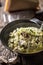 Italian risotto zucchini mushrooms and parmesan in dark plate