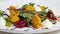 Italian roast beet salad. Salad of roasted beets with goat cheese and pine nuts on white dish isolated on a white