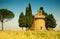 Italian rural landscape with a chapel on a hill