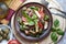 Italian salad Panzanella with bread and tomatoes on brown plate