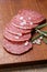 Italian salami sausage slices with rosemary and sea salt