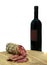 Italian sausage and wine bottle