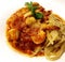Italian Seafood Fettuccine pasta dish on white bowl background