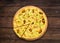 Italian seafood pizza at wood background