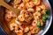 Italian shrimp scampi on a skillet, close-up