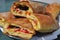 Italian Sicilian street food: pane cunzato. Tomato, pecorino sandwich