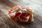 Italian sliced cured coppa with spices. Raw ham. Crudo or jamon with rosemary