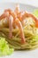 Italian spaghetti with langounginami shrimps and green salad. Seafood pasta with olive oil, headless shrimp prawns tails