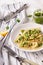Italian spinach ravioli with pesto sauce and parmesan