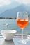 Italian Spritz cocktail against lake Como, Italy