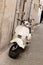 Italian streets city town and a popular single transport scooter parked by the wall in the empty street