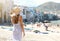 Italian summer. Back view of young woman goes down to the beach of the old town of Cefalu in Sicily