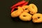 Italian Tarallini with red peppers on slate background